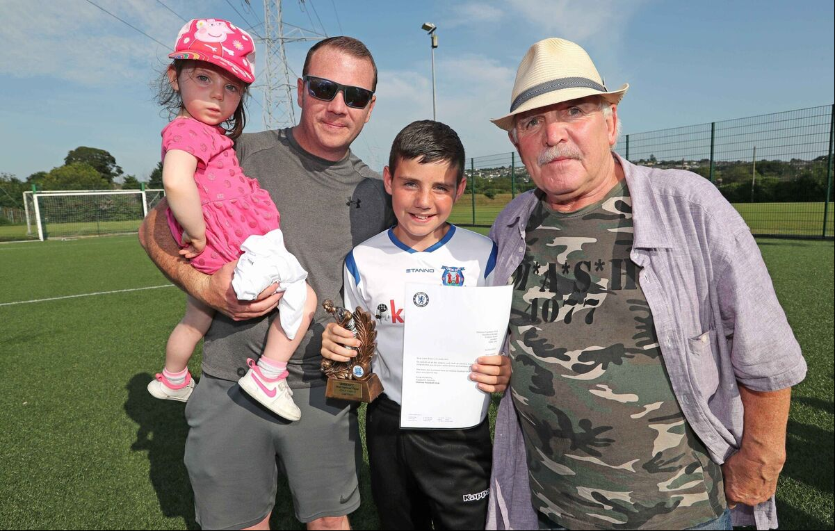  Liam Waters, Under 12 Most Improved Player with his sister, Libbie, dad Trevor and grandad, Gerry Miller.