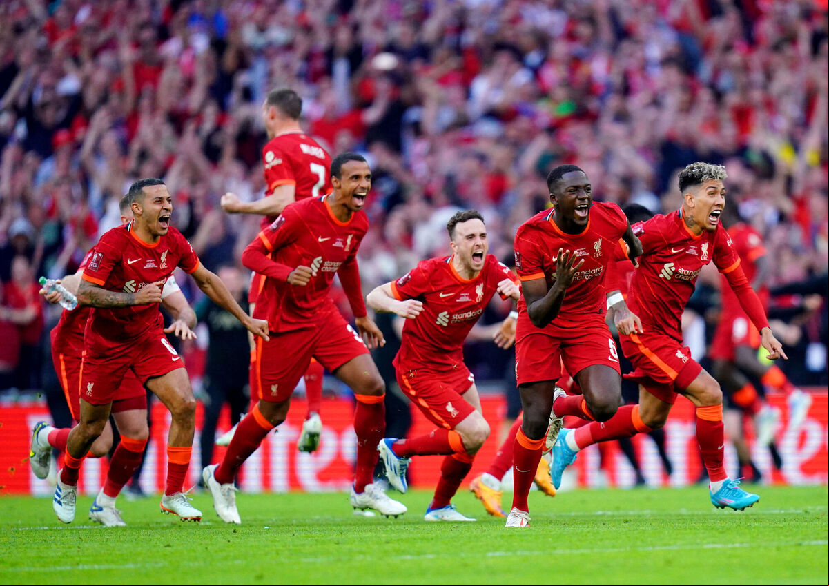 Liverpool players celebrate after team-mate Kostas Tsimikas (not pictured) scores the winning penalty of the Emirates FA Cup final at Wembley Stadium, London on May 14, 2022. Picture: Adam Davy/PA Wire. Liverpool players celebrate after team-mate Kostas Tsimikas (not pictured) scores the winning penalty of the Emirates FA Cup final at Wembley Stadium, London on May 14, 2022. Picture: Adam Davy/PA Wire.
